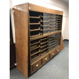 An early 20th century haberdashery chest fitted forty-four pull out drawers an four drawers