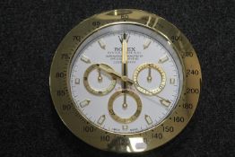 A contemporary "Rolex" advertising wall clock (battery operated)