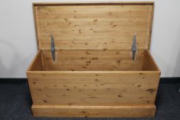 A stripped pine blanket box