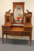 A Victorian inlaid mahogany sunk centre dressing table