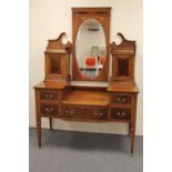 A Victorian inlaid mahogany sunk centre dressing table