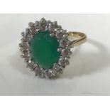 A 9ct gold synthetic emerald cluster ring, size P CONDITION REPORT: 3.