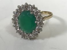 A 9ct gold synthetic emerald cluster ring, size P CONDITION REPORT: 3.