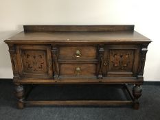 A Victorian oak sideboard with inlaid panel doors,