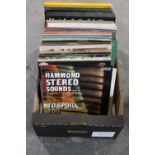 A box of vinyl LP records and boxed sets - world music,