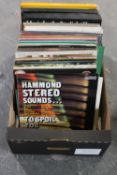 A box of vinyl LP records and boxed sets - world music,