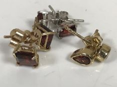 Three pairs of gold garnet earrings CONDITION REPORT: 2.