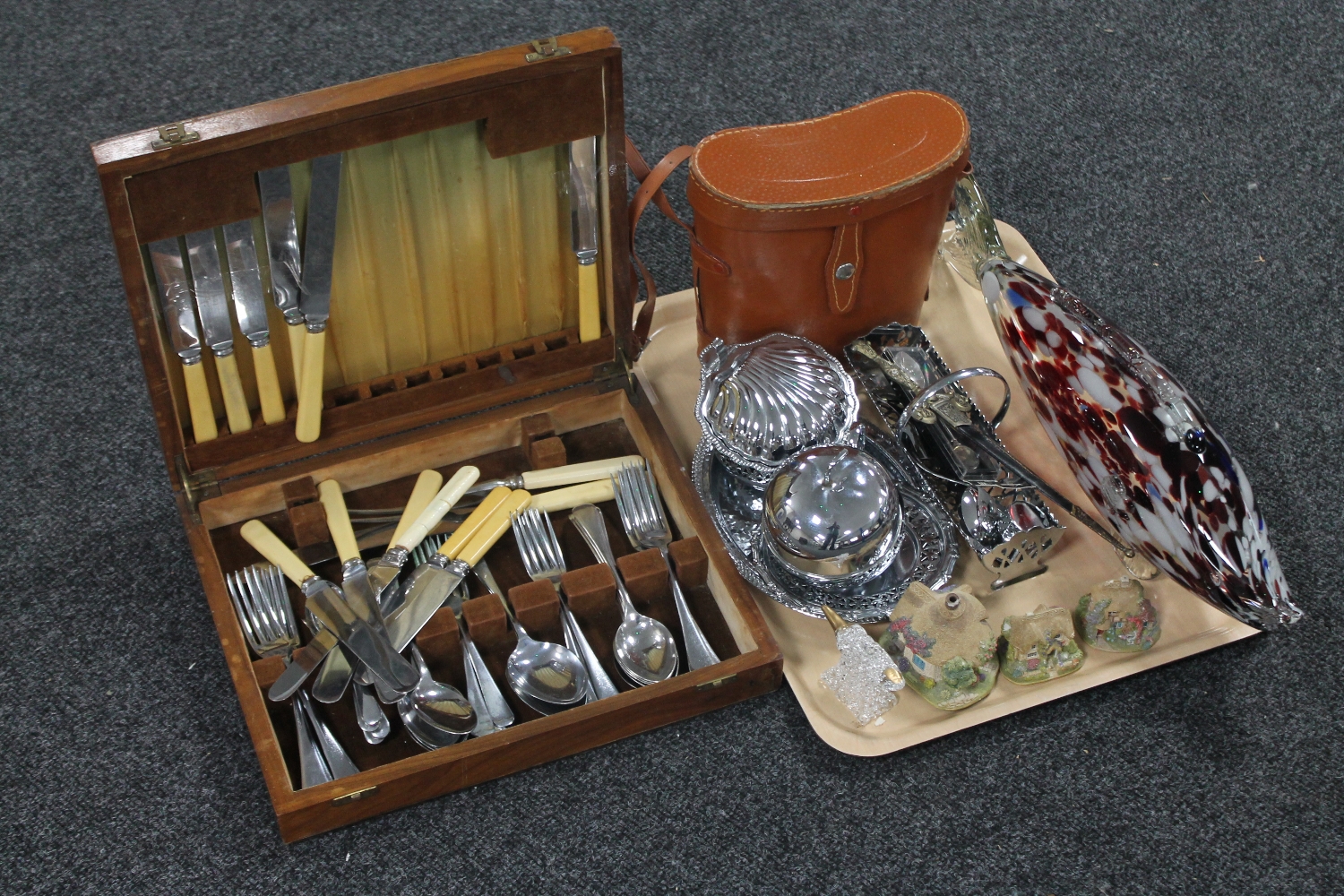 A tray of assorted plated pieces, letter opener, cottage ornaments, binoculars in leather case,