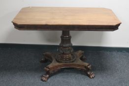 A 19th century mahogany breakfast table on paw feet