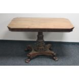 A 19th century mahogany breakfast table on paw feet