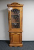 A contemporary Sostramo corner display cabinet