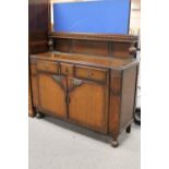 A 1930's oak buffet back sideboard