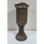 An embossed trench art shell vase