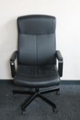 A black leather office armchair