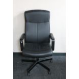 A black leather office armchair