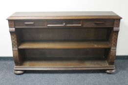 A set of continental oak open shelves on bun feet