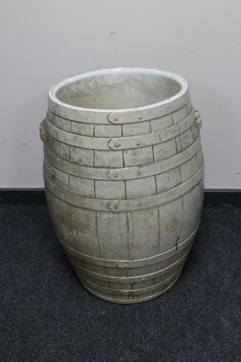A large glazed earthenware barrel
