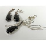 A silver and polished hard stone necklace and earring suite