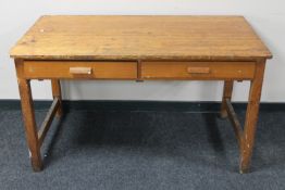 A mid 20th century school table fitted two drawers