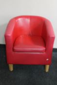 A tub chair in red vinyl
