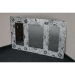 A frameless mosaic mirror