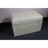 A mid 20th century cream vinyl storage footstool