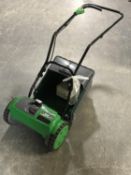 A GTech CMO1 cordless cylinder mower with battery and charger