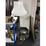 A standard lamp with shade and four assorted mirrors