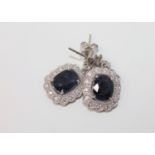 A pair of 18ct white gold sapphire and diamond earrings,