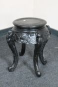 An oriental style ebonised plant stand