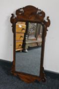 An antique Chippendale style wall mirror