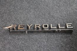 A cast iron Reyrolle metal sign
