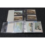 Two albums of antique and later postcards
