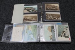 Two albums of antique and later postcards