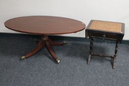 An inlaid mahogany pedestal coffee table together with a mahogany leather topped sofa table