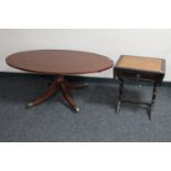 An inlaid mahogany pedestal coffee table together with a mahogany leather topped sofa table