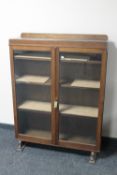 An early 20th century double door display cabinet