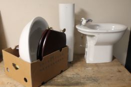 A sink and pedestal together with a bidet,