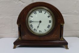 An antique mahogany Swiss made mantel clock by Buren