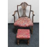 An antique oak Hepplewhite style armchair and an oak footstool