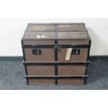 A wooden bound shipping trunk