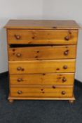 A pine five drawer chest