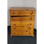 A pine five drawer chest