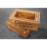 Two sets of four graduated Game of Thrones wooden caddies