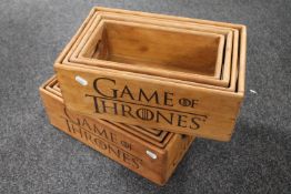 Two sets of four graduated Game of Thrones wooden caddies