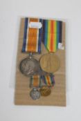 Two WWI medals, Victory Medal and British War Medal on ribbons with accompanying miniatures,