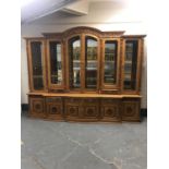 An impressive oriental style high gloss glazed, breakfront bookcase,