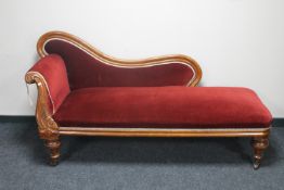A Victorian mahogany chaise longue in red fabric