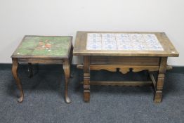 A tiled top continental coffee table and an occasional table
