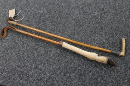 A vintage horn handled riding crop and a deer's hoof handled riding crop